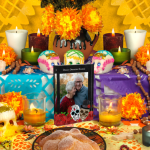 Custom Dearly Departed photo block featuring a couple of really cute vintage sugar skull on a bed of red roses.